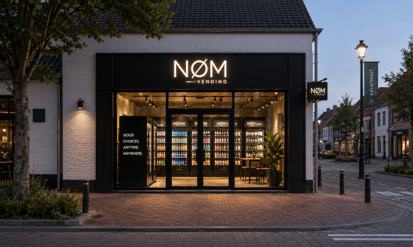 NØM vending storefront glowing warmly in an evening streetscape.